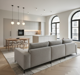 Primjer kako pravilno postavljena kutna garnitura stvara prirodnu granicu u otvorenom tlocrtu